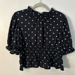 Black top with powder blue polka dots. Size XL